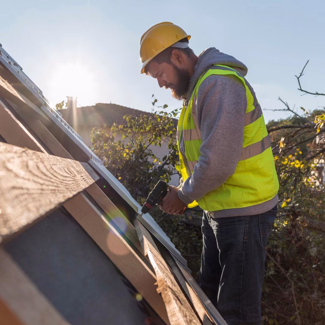 man-working-roof-with-drill_23-2148748770